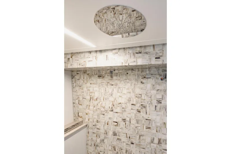 Sea Suite Yacht Photos Pics Luxurious interior of 2021 Pershing 62 yacht with elegant marble wall design.