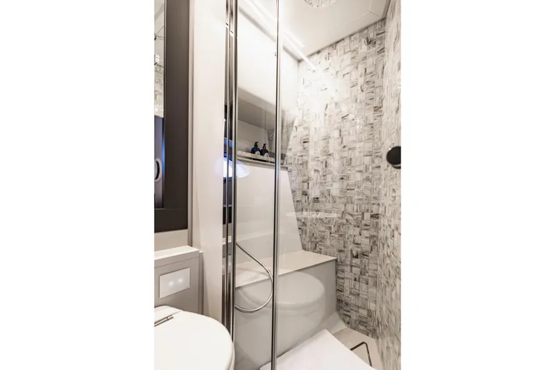 Sea Suite Yacht Photos Pics Luxurious bathroom in 2021 Pershing 62 yacht with modern shower and elegant tile design.