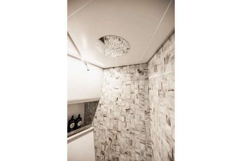 Sea Suite Yacht Photos Pics Luxurious bathroom interior of 2021 Pershing 62 yacht with elegant tile design.