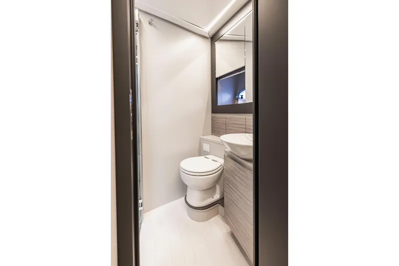 Sea Suite Yacht Photos Pics Modern bathroom interior on 2021 Pershing 62 yacht, featuring sleek design and fixtures.