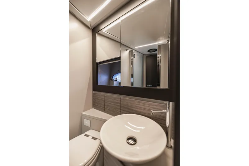 Sea Suite Yacht Photos Pics Luxurious bathroom interior of 2021 Pershing 62 yacht with modern fixtures and elegant design.