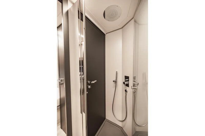 Sea Suite Yacht Photos Pics Modern shower area in 2021 Pershing 62 yacht, featuring sleek design and fixtures.