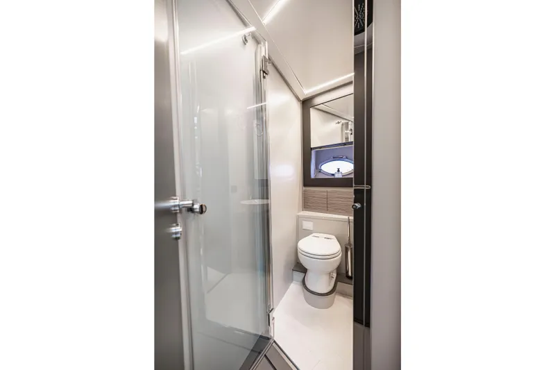 Sea Suite Yacht Photos Pics Luxurious bathroom in 2021 Pershing 62 yacht, featuring modern fixtures and sleek design.