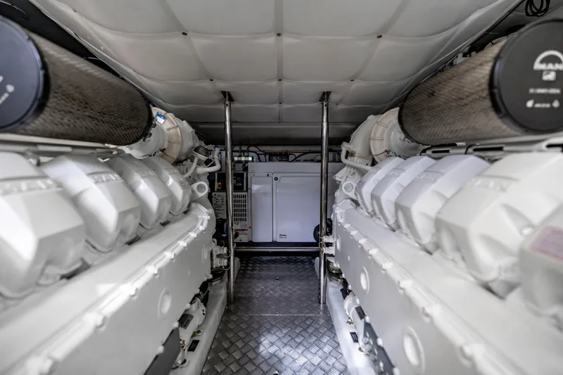 Sea Suite Yacht Photos Pics Engine room of 2021 Pershing 62 yacht, featuring dual engines and advanced machinery.