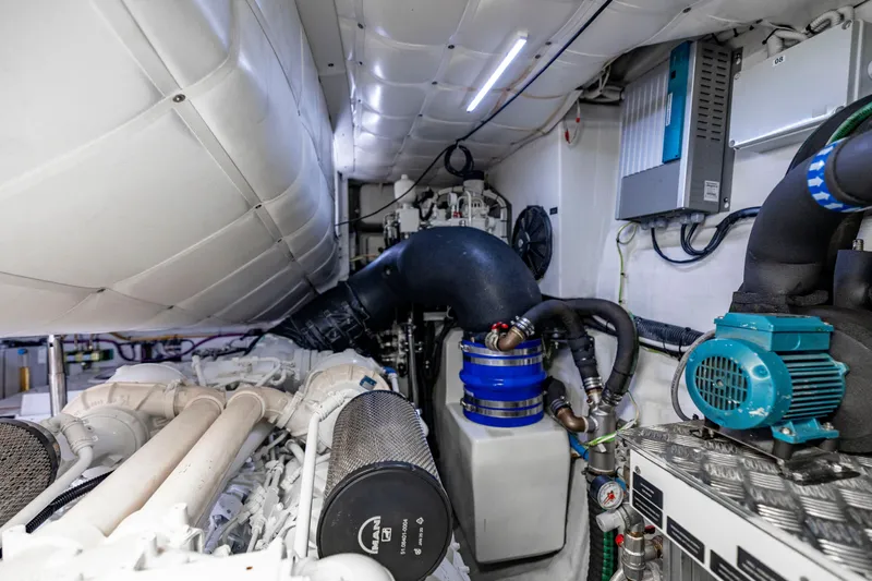 Sea Suite Yacht Photos Pics Engine room of a 2021 Pershing 62 yacht, showcasing advanced machinery and components.