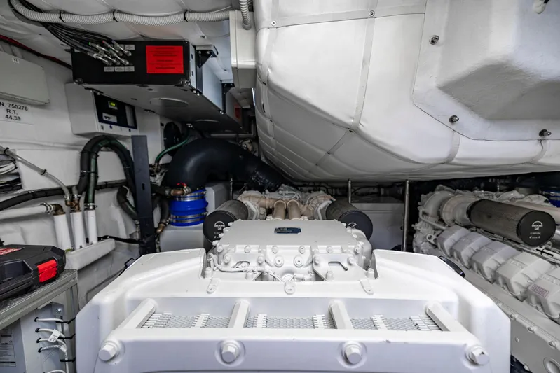 Sea Suite Yacht Photos Pics Engine room of a 2021 Pershing 62 yacht, showcasing advanced machinery and components.