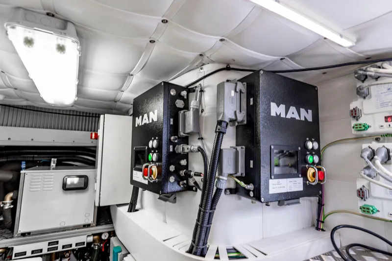 Sea Suite Yacht Photos Pics Engine room of 2021 Pershing 62 yacht featuring MAN equipment and control systems.