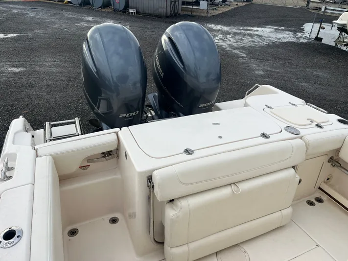  Yacht Photos Pics 2022 Grady-White Fisherman 257 boat with dual Yamaha 200 engines, docked on gravel.