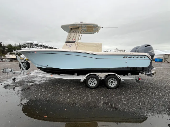  Yacht Photos Pics 2022 Grady-White Fisherman 257 boat on trailer, side view, outdoors.