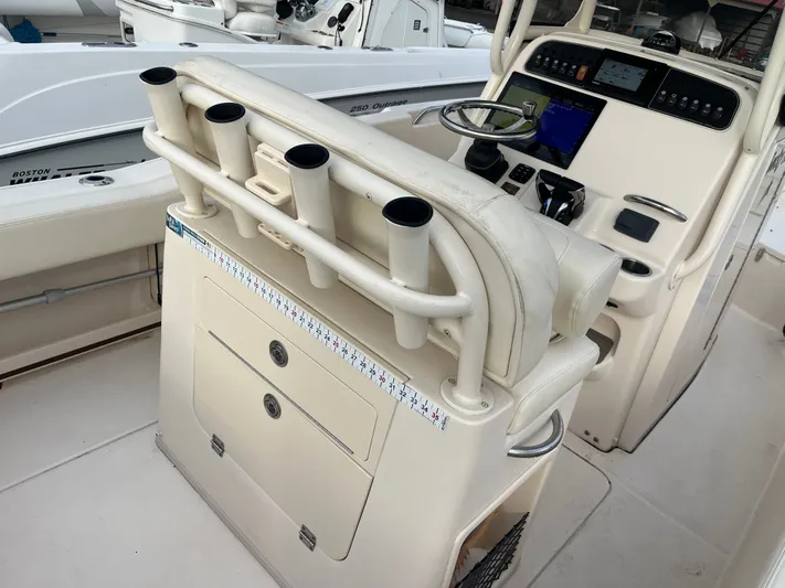  Yacht Photos Pics 2022 Grady-White Fisherman 257 boat console with rod holders and navigation equipment.