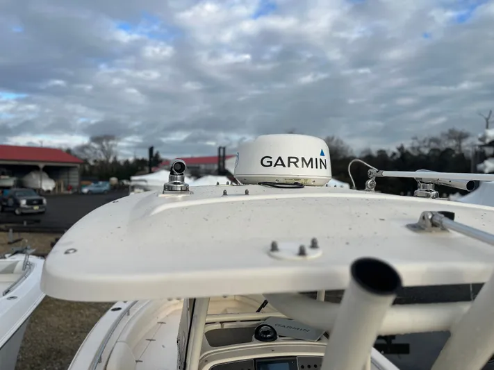  Yacht Photos Pics 2022 Grady-White Fisherman 257 boat with Garmin radar, cloudy sky background.
