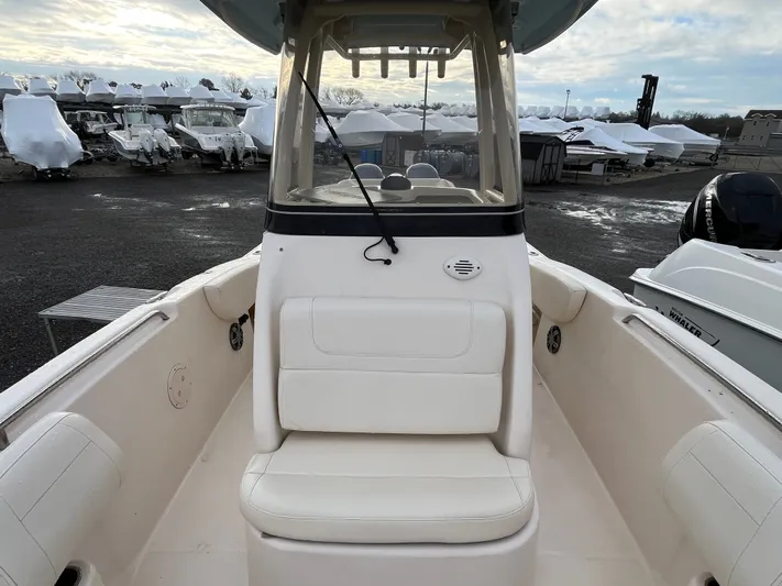  Yacht Photos Pics 2022 Grady-White Fisherman 257 boat interior with seating, docked in a marina.
