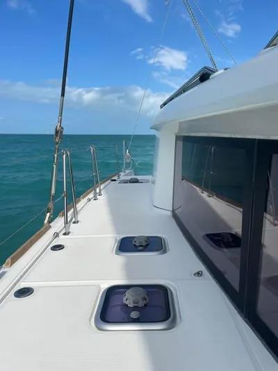 Freebird Yacht Photos Pics 2018 Lagoon 450 F catamaran deck with ocean view under clear blue sky.