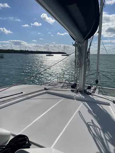 Freebird Yacht Photos Pics Sailing on a 2018 Lagoon 450 F catamaran, sunlit sea view.