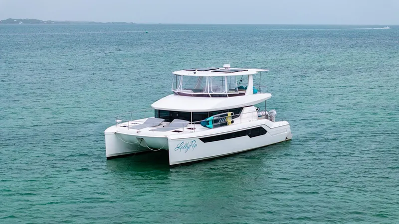 Lollypop Yacht Photos Pics 2022 Leopard 53 Powercat yacht on calm ocean waters.