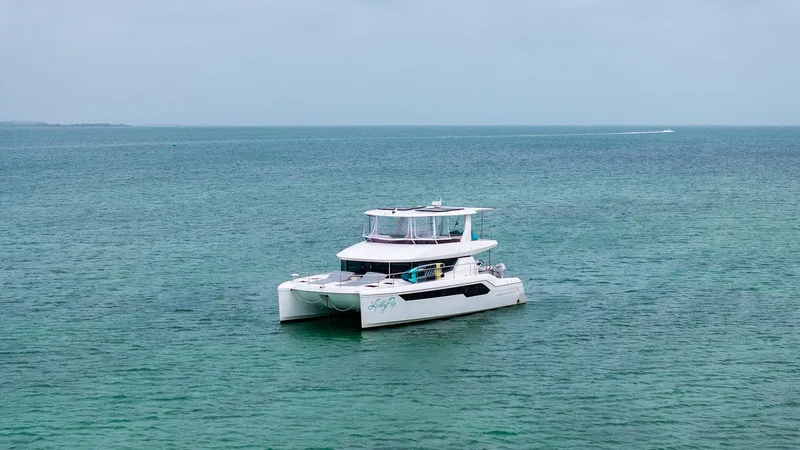 Lollypop Yacht Photos Pics 2022 Leopard 53 Powercat yacht on calm ocean waters.