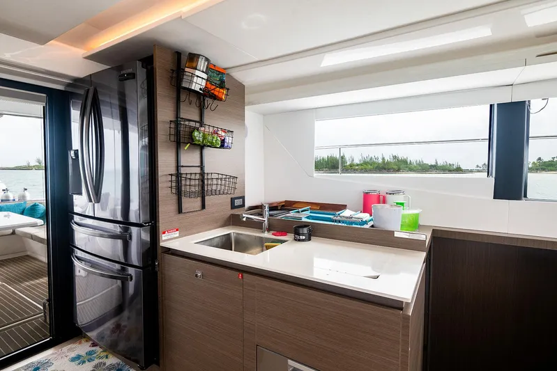 Lollypop Yacht Photos Pics Modern kitchen interior on 2022 Leopard 53 Powercat yacht, featuring sleek design and ocean view.