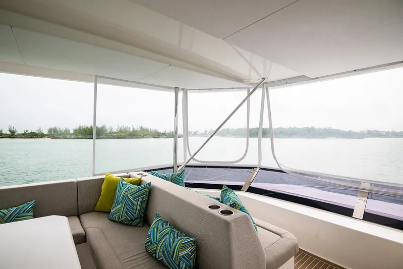 Lollypop Yacht Photos Pics Leopard 53 Powercat 2022 yacht interior with comfortable seating and scenic water view.