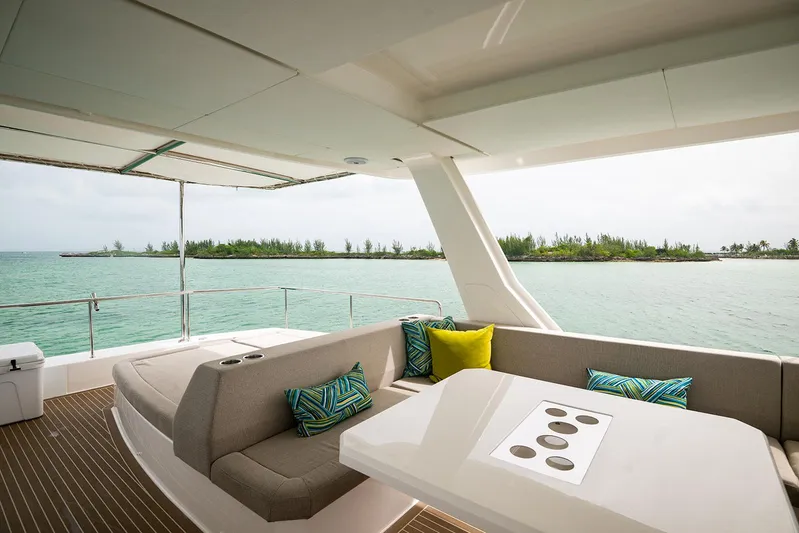 Lollypop Yacht Photos Pics Luxurious Leopard 53 Powercat 2022 yacht interior with ocean view and stylish seating area.
