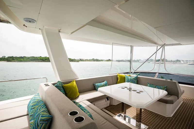 Lollypop Yacht Photos Pics Luxurious Leopard 53 Powercat 2022 yacht interior with elegant seating and ocean view.