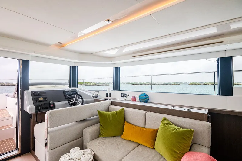 Lollypop Yacht Photos Pics Interior of 2022 Leopard 53 Powercat yacht with modern helm and cozy seating area.