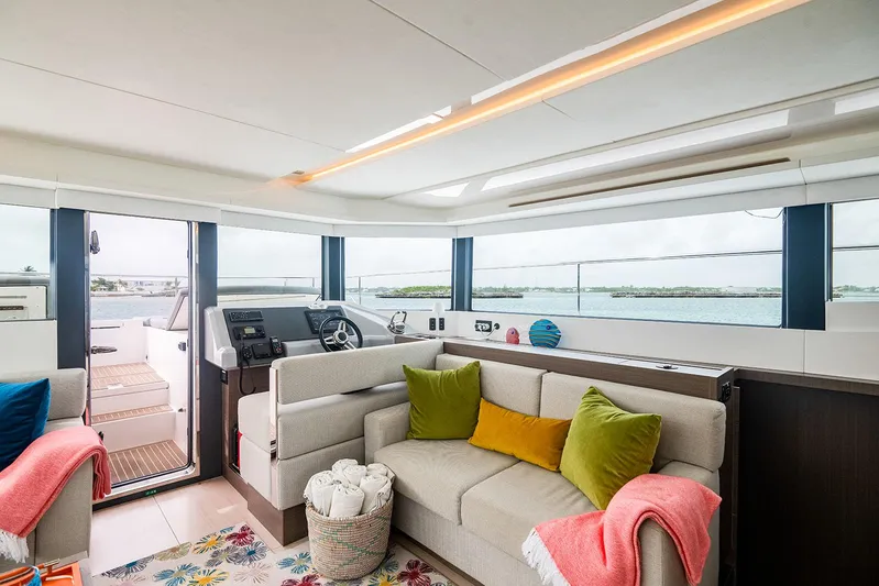 Lollypop Yacht Photos Pics Luxurious interior of 2022 Leopard 53 Powercat yacht with modern seating and ocean view.