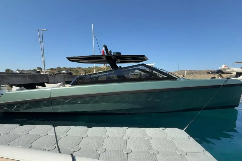  Yacht Photos Pics 2025 Wally Tender 43 yacht docked, sleek design, modern features, calm water setting.