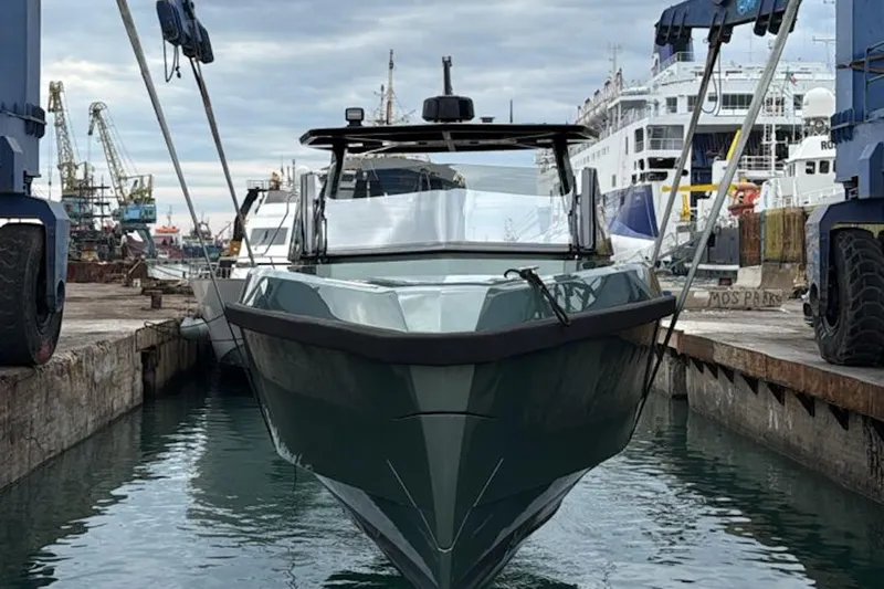  Yacht Photos Pics 2025 Wally Tender 43 yacht docked at a busy shipyard.