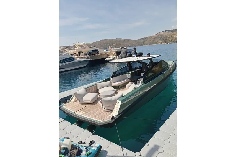  Yacht Photos Pics 2025 Wally Tender 43 luxury yacht docked in a scenic marina.