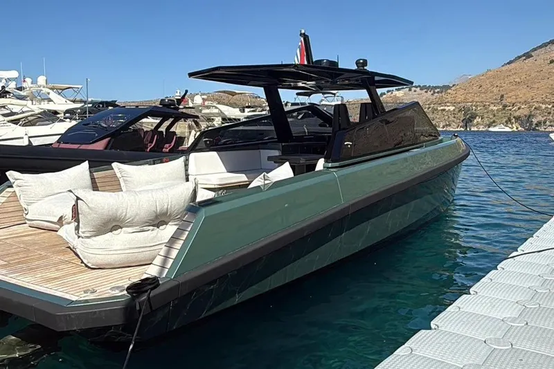  Yacht Photos Pics 2025 Wally Tender 43 luxury yacht docked in clear blue water, featuring sleek design and plush seating.