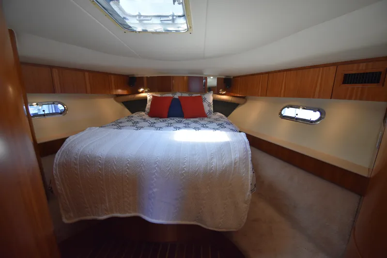 Current Situation Yacht Photos Pics Luxurious bedroom interior of 2001 Tiara Yachts 52 Sport Yacht with cozy bedding.