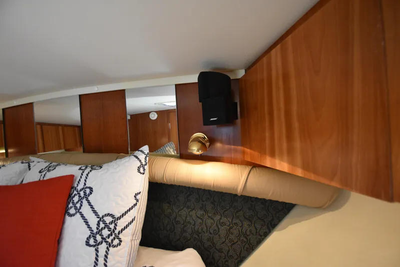 Current Situation Yacht Photos Pics Interior of 2001 Tiara Yachts 52 Sport Yacht with wood paneling and decorative pillows.