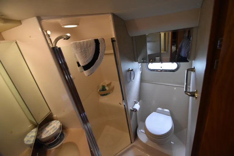 Current Situation Yacht Photos Pics Bathroom interior of 2001 Tiara Yachts 52 Sport Yacht, featuring shower and toilet.