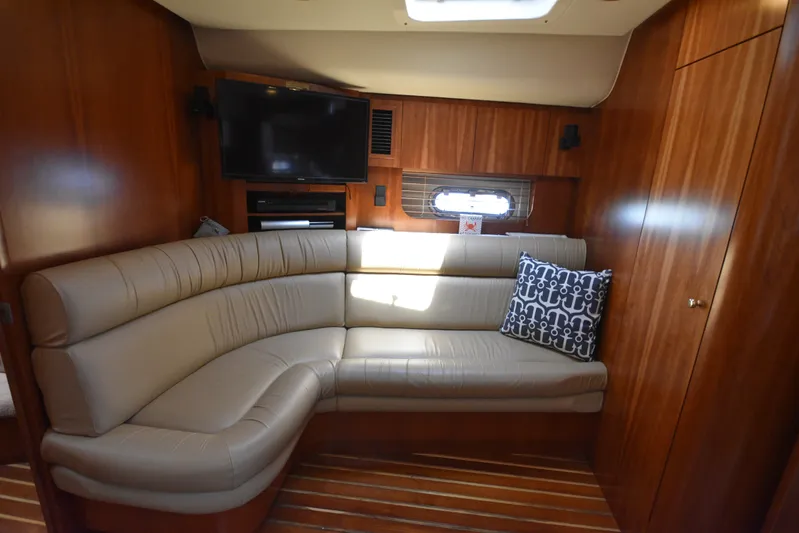 Current Situation Yacht Photos Pics Luxurious interior of 2001 Tiara Yachts 52 Sport Yacht with leather seating and wood paneling.