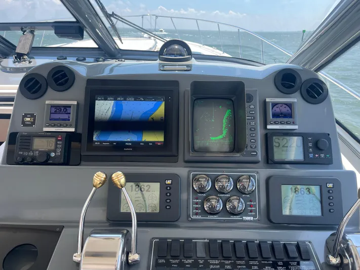 Current Situation Yacht Photos Pics Cockpit of 2001 Tiara Yachts 52 Sport Yacht with navigation and control instruments.
