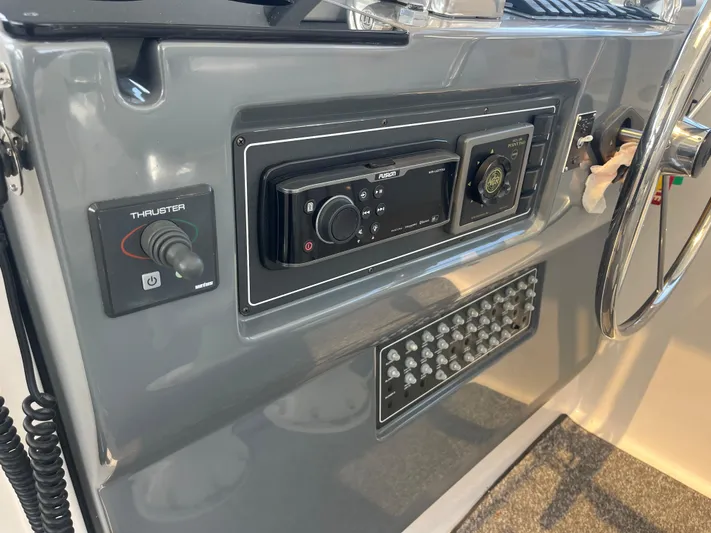 Current Situation Yacht Photos Pics Control panel of a 2001 Tiara Yachts 52 Sport Yacht with thruster and navigation controls.