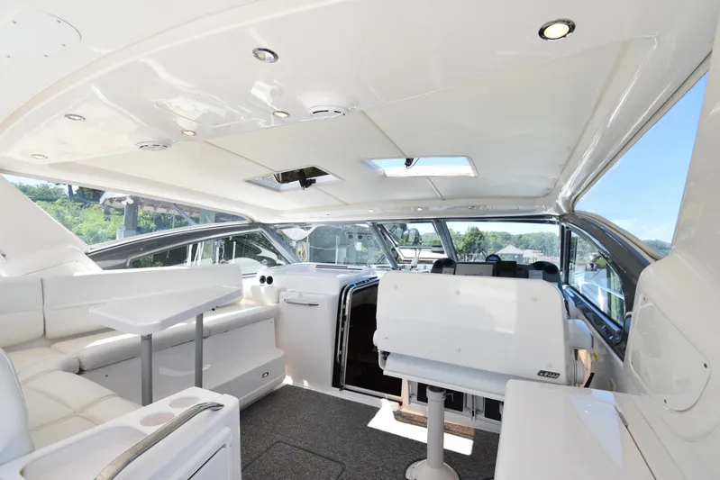 Current Situation Yacht Photos Pics Luxurious interior of 2001 Tiara Yachts 52 Sport Yacht with white seating and modern design.