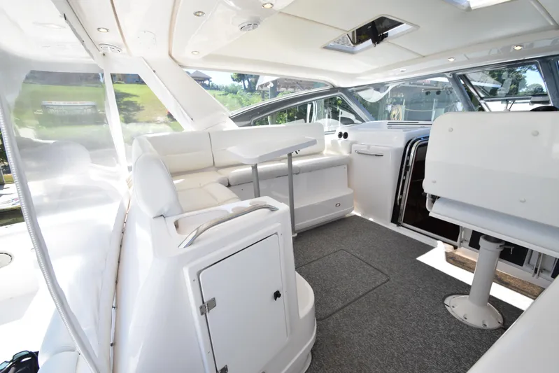 Current Situation Yacht Photos Pics Luxurious interior of 2001 Tiara Yachts 52 Sport Yacht with white seating and modern design.