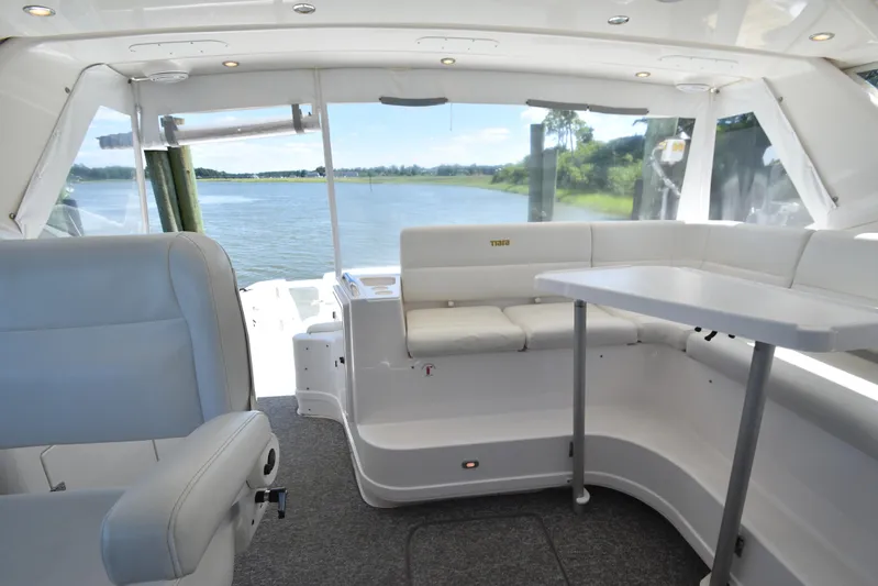 Current Situation Yacht Photos Pics Interior of 2001 Tiara Yachts 52 Sport Yacht with white seating and scenic water view.