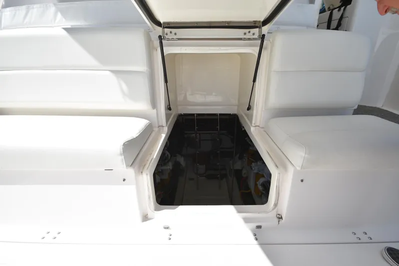 Current Situation Yacht Photos Pics Open engine compartment of 2001 Tiara Yachts 52 Sport Yacht with white seating.