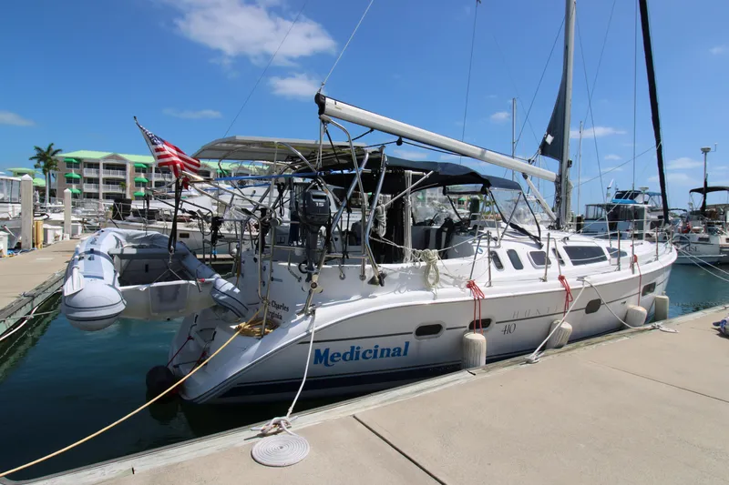 Medicinal Yacht Photos Pics 2002 Hunter 410 sailboat docked at marina under clear blue sky.