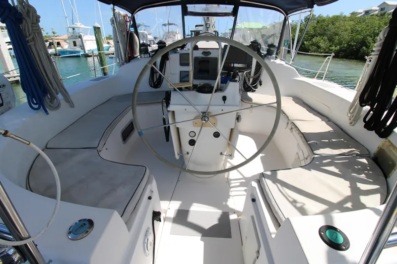 Medicinal Yacht Photos Pics Spacious cockpit of 2002 Hunter 410 sailboat with steering wheel and seating.