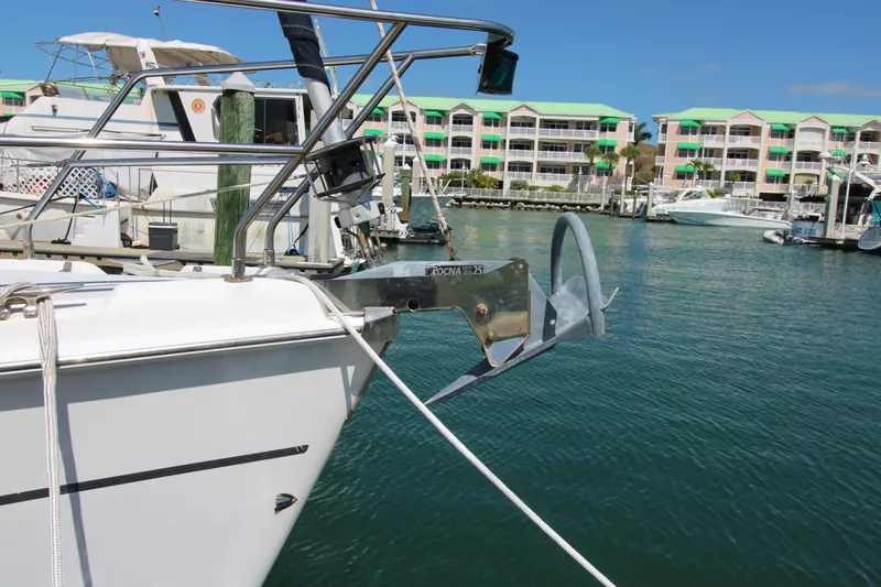 Medicinal Yacht Photos Pics Sailboat anchored in marina, Hunter 410 model, 2002, with waterfront buildings in background.