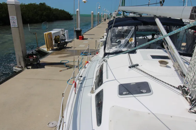 Medicinal Yacht Photos Pics Sailboat docked at marina, Hunter 410 model, 2002, with clear blue sky and calm waters.