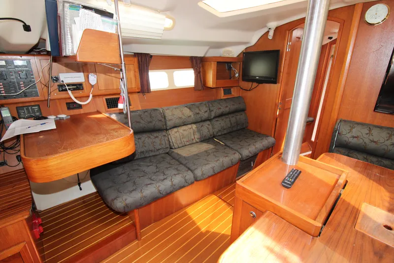 Medicinal Yacht Photos Pics Interior of a 2002 Hunter 410 sailboat with wood finish and comfortable seating.