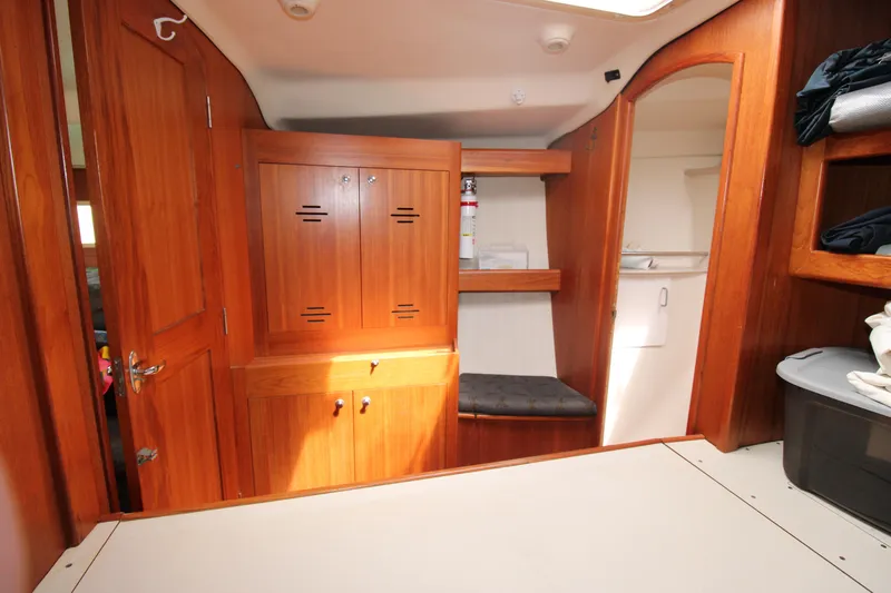 Medicinal Yacht Photos Pics Interior of 2002 Hunter 410 sailboat with wooden cabinetry and seating area.