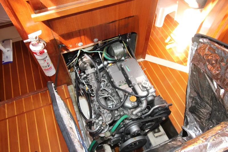 Medicinal Yacht Photos Pics Engine compartment of a 2002 Hunter 410 sailboat with visible fire extinguisher.