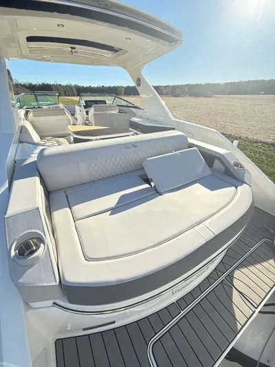 The Good Stuff Yacht Photos Pics 2023 Sea Ray SLX 310 OB luxury boat with spacious seating and sleek design.