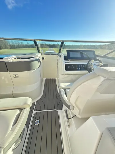 The Good Stuff Yacht Photos Pics 2023 Sea Ray SLX 310 OB boat interior with modern dashboard and seating.