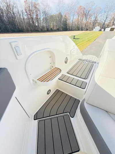 The Good Stuff Yacht Photos Pics 2023 Sea Ray SLX 310 OB boat deck with sleek seating and modern design.